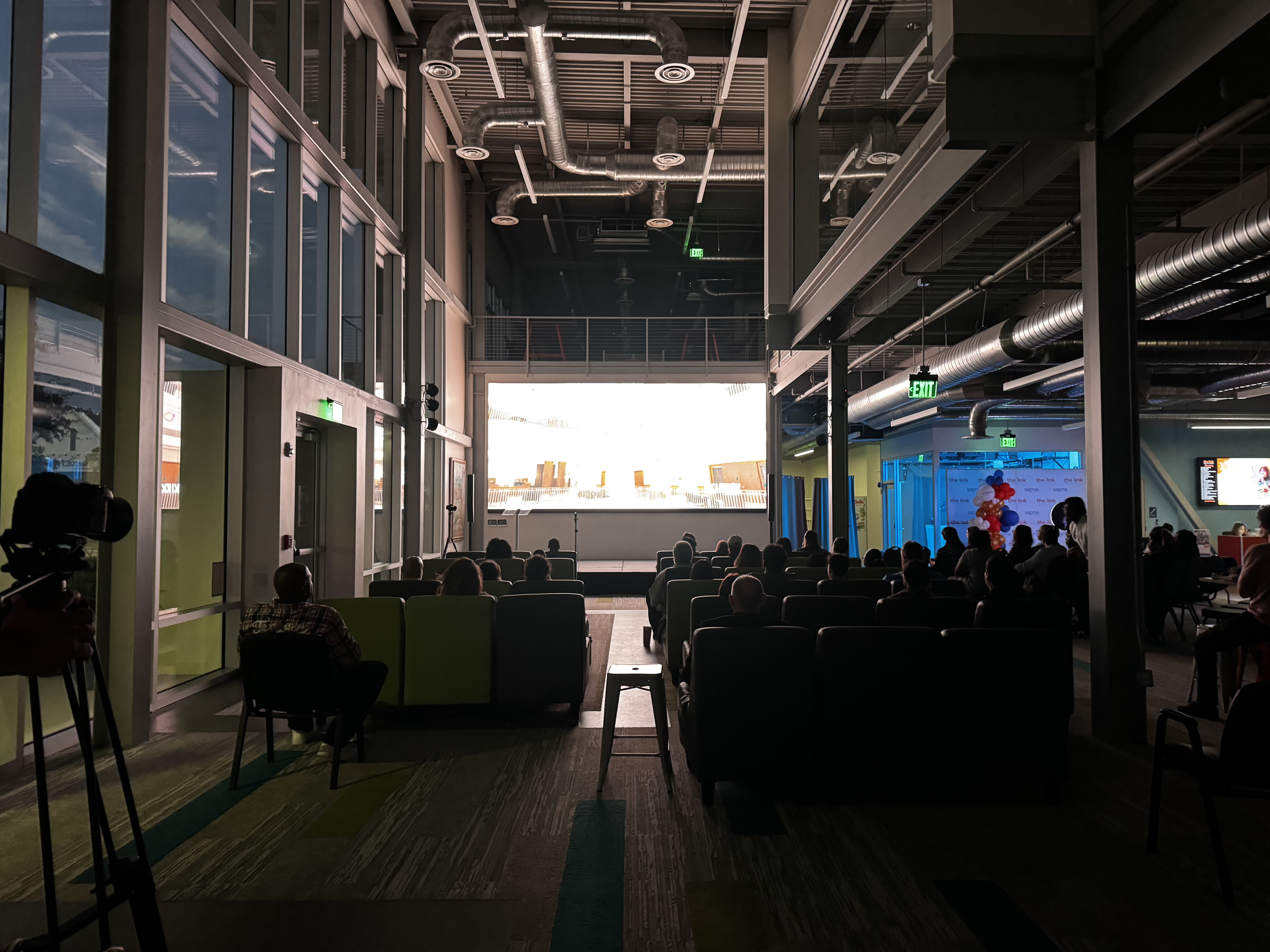 Audience watching short film screenings at JaxFuse Film Day